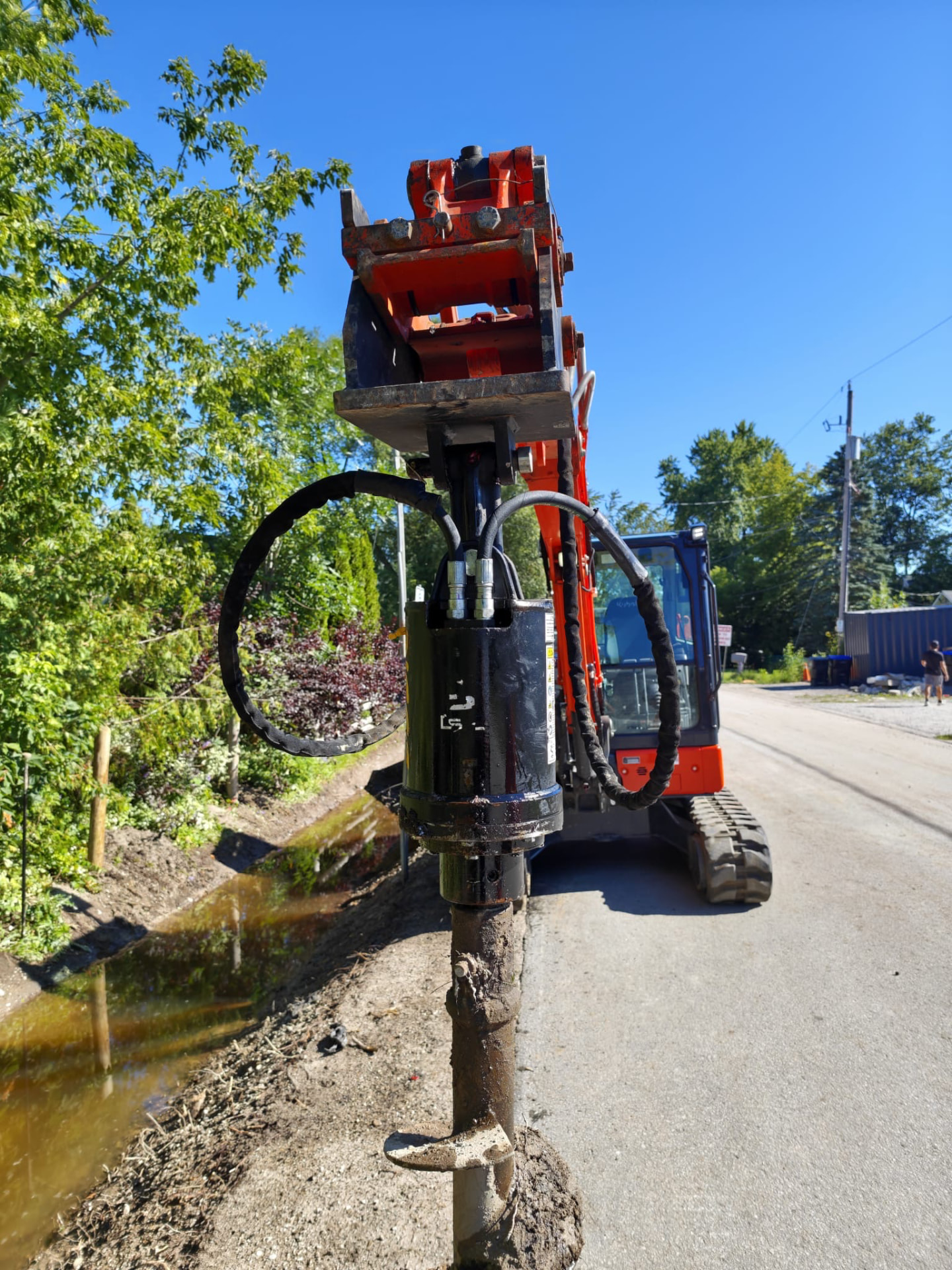 Excavator auger and hydraulic attachment service