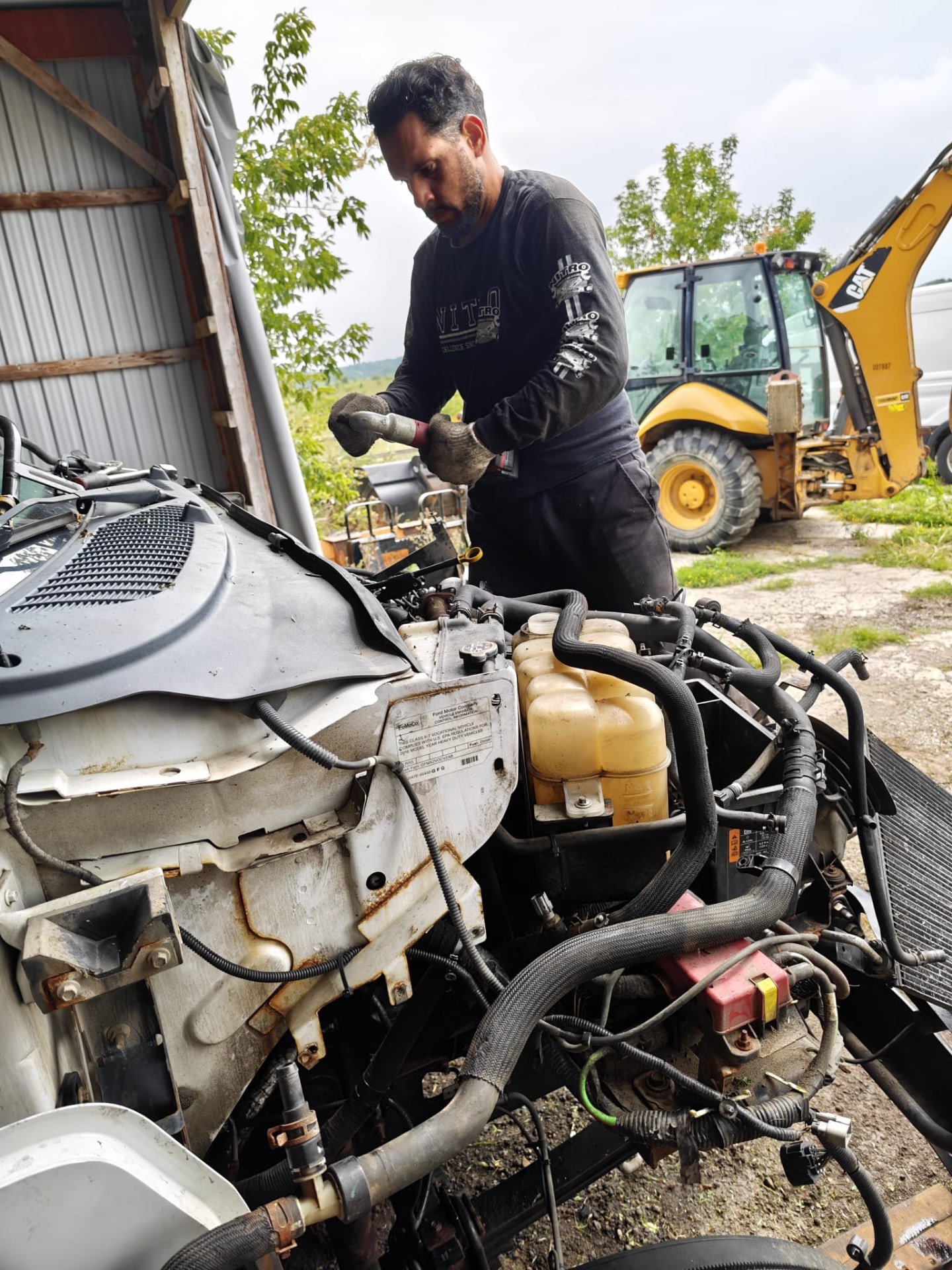 Heavy diesel engine repair with equipment on site
